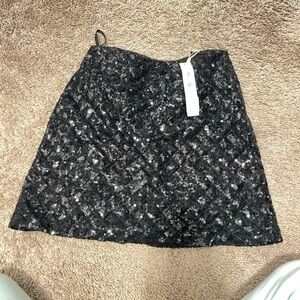 She & Sky black sequin mini skirt. Zip up in the back. 
Perfect condition NWT.